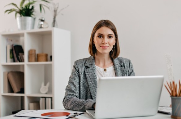 business-woman-checkered-jacket-with-smile-while-sitting-desk-her-office